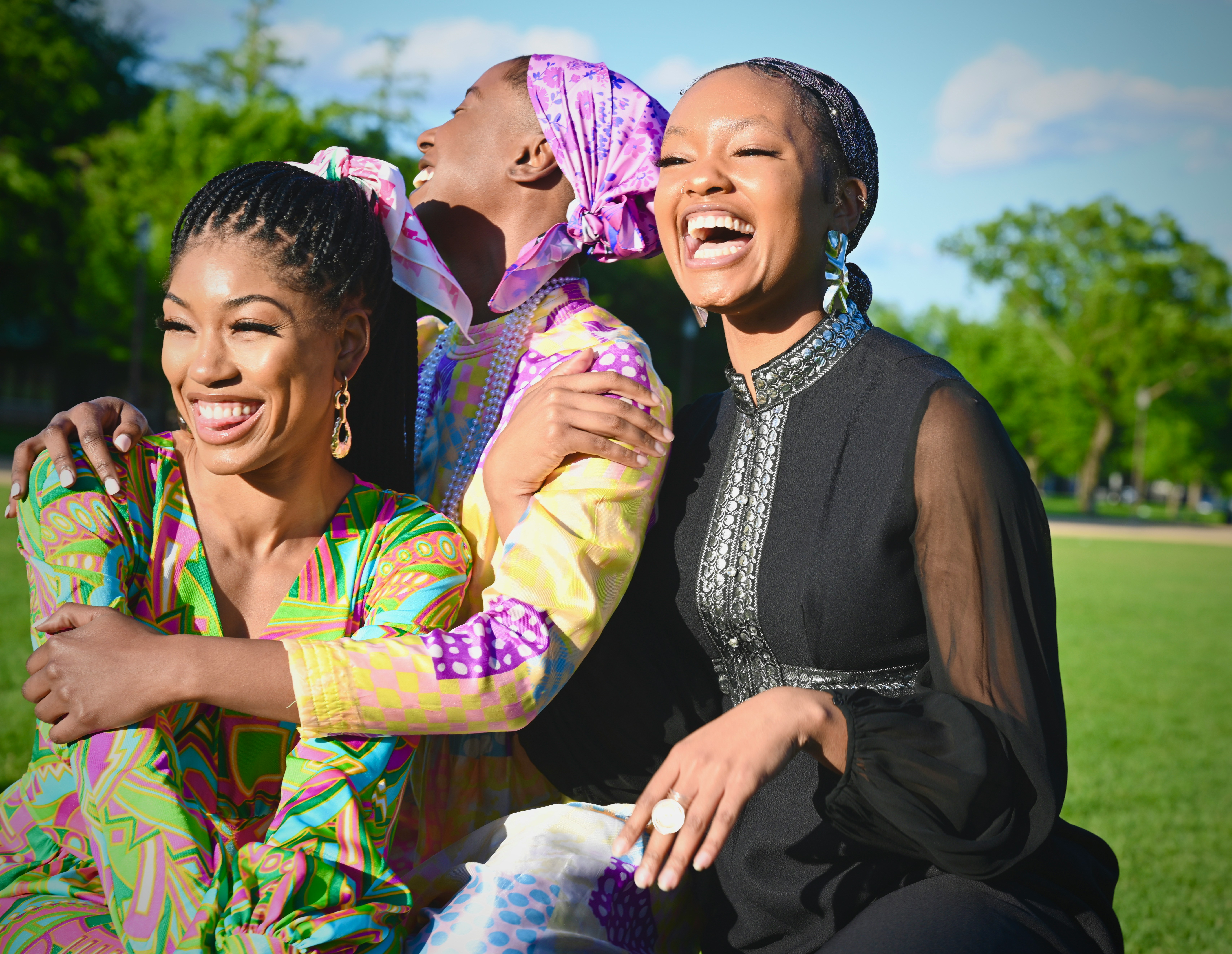 Three joyful women celebrating togetherness on a Zawadi sisterhood escape